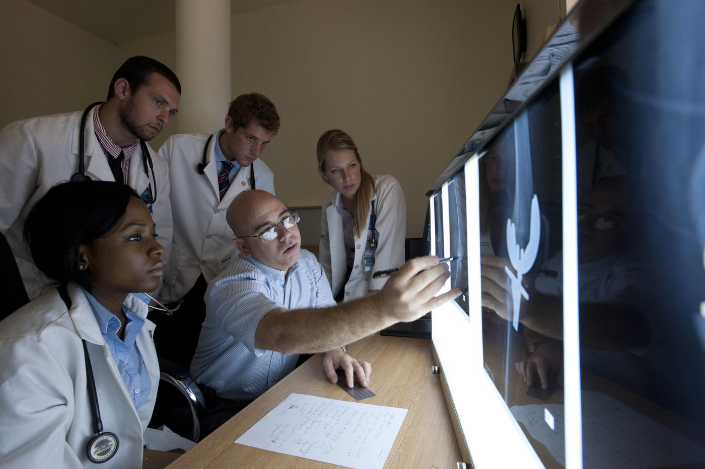 Students and faculty viewing intensifying screen