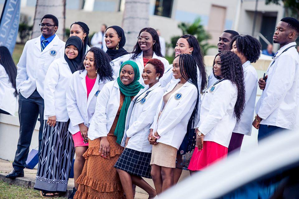 Medical students standing in a group posing for a picture
