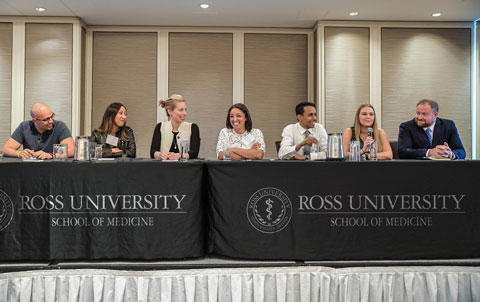 Group sitting on panel at Ross University