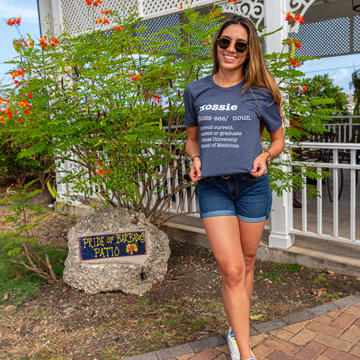 Student outside showing off shirt