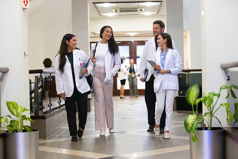 Medical students walking in a hallway